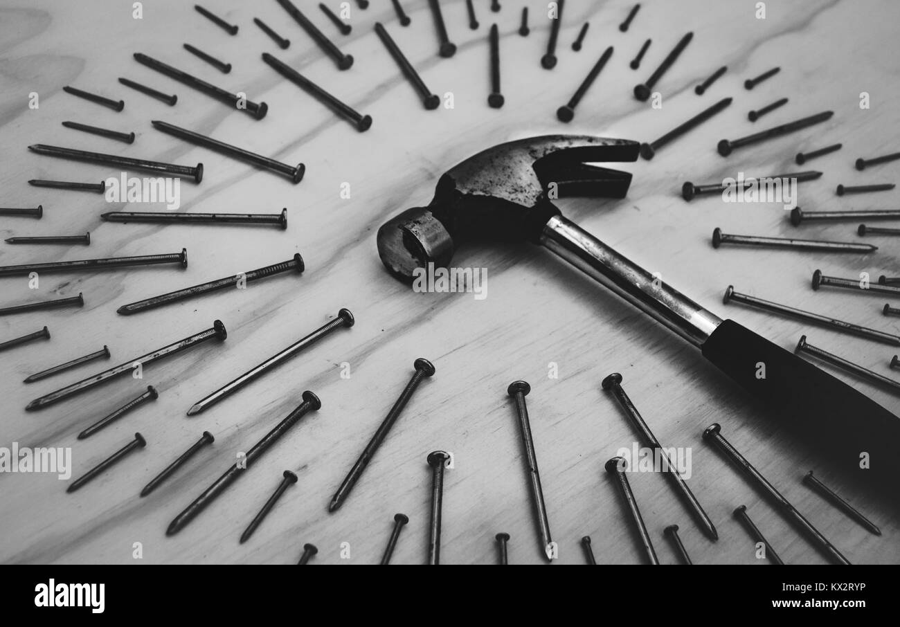Photograph of a hammer and nails on wood background Stock Photo Alamy