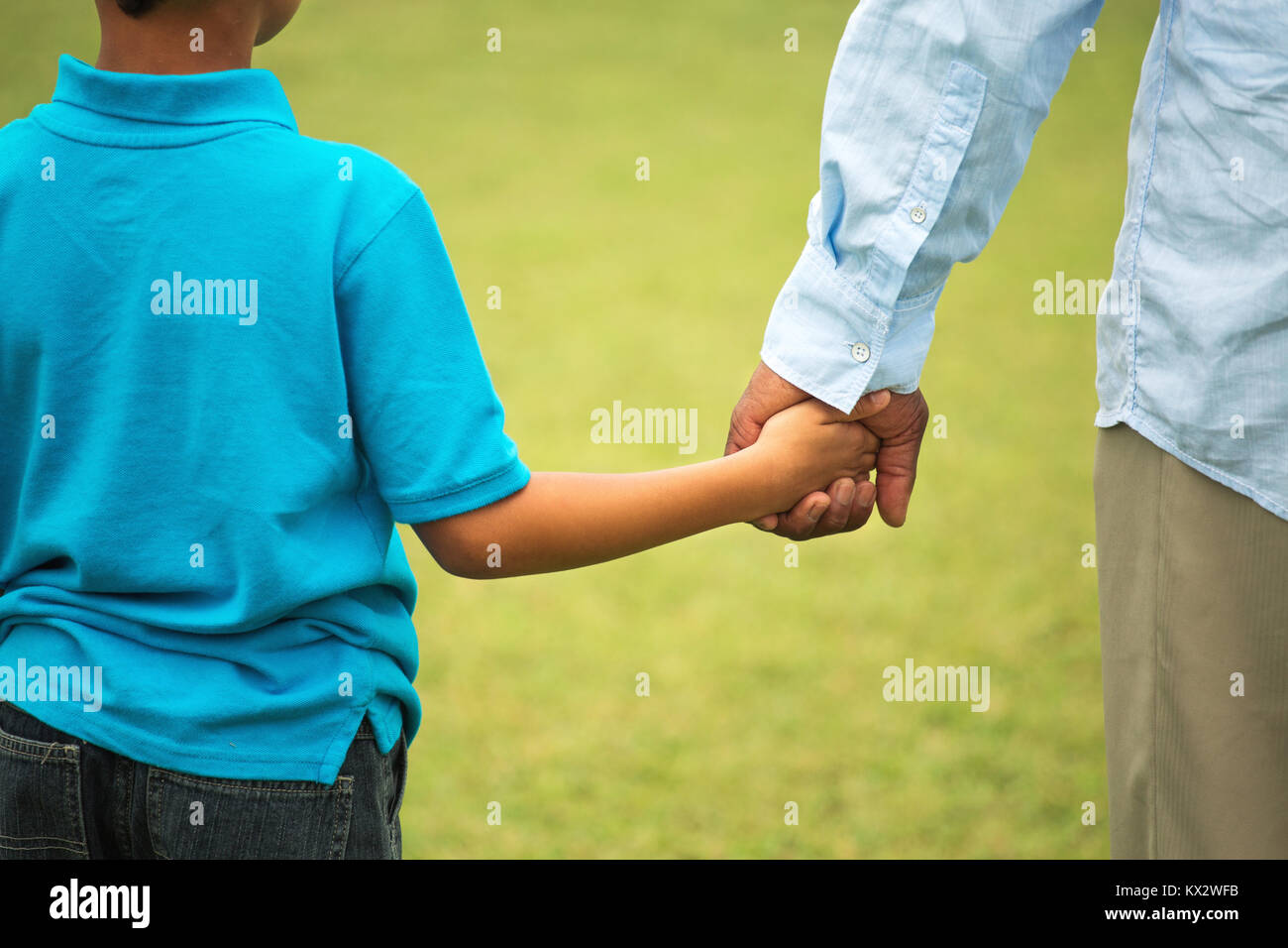 Father and son playing outside. Stock Photo