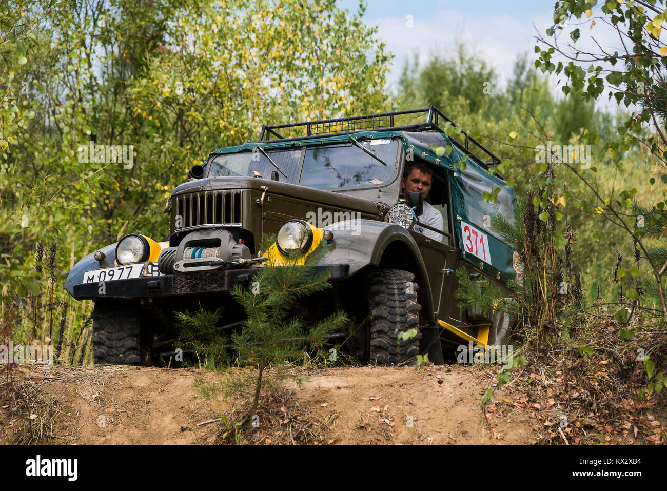 Lviv, Ukraine - August 23, 2015: Off-road vehicle brand GAZ-69 (UAZ) overcomes the track on of sandy career near the city Lviv, Ukraine. Stock Photo