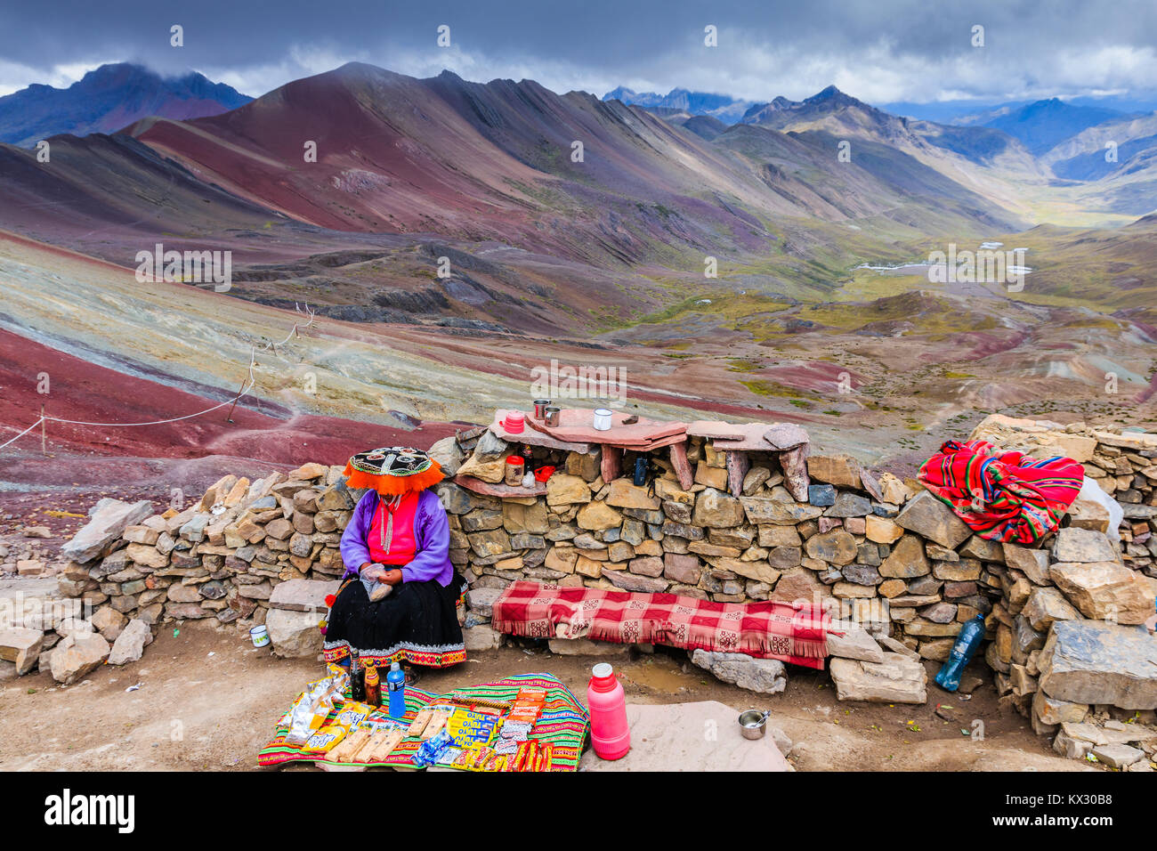 RAINBOW MOUNTAINES PERU - APRIL 25, 2017: Native peruvian woman wearing traditional clothes and selling souvenirs for tourists. Stock Photo