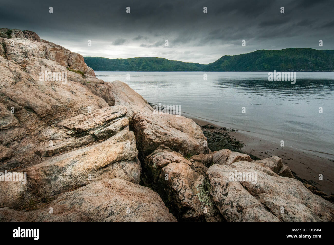 Rocks on the shore of the Saguenay Fjord, a rainy day in the Baie