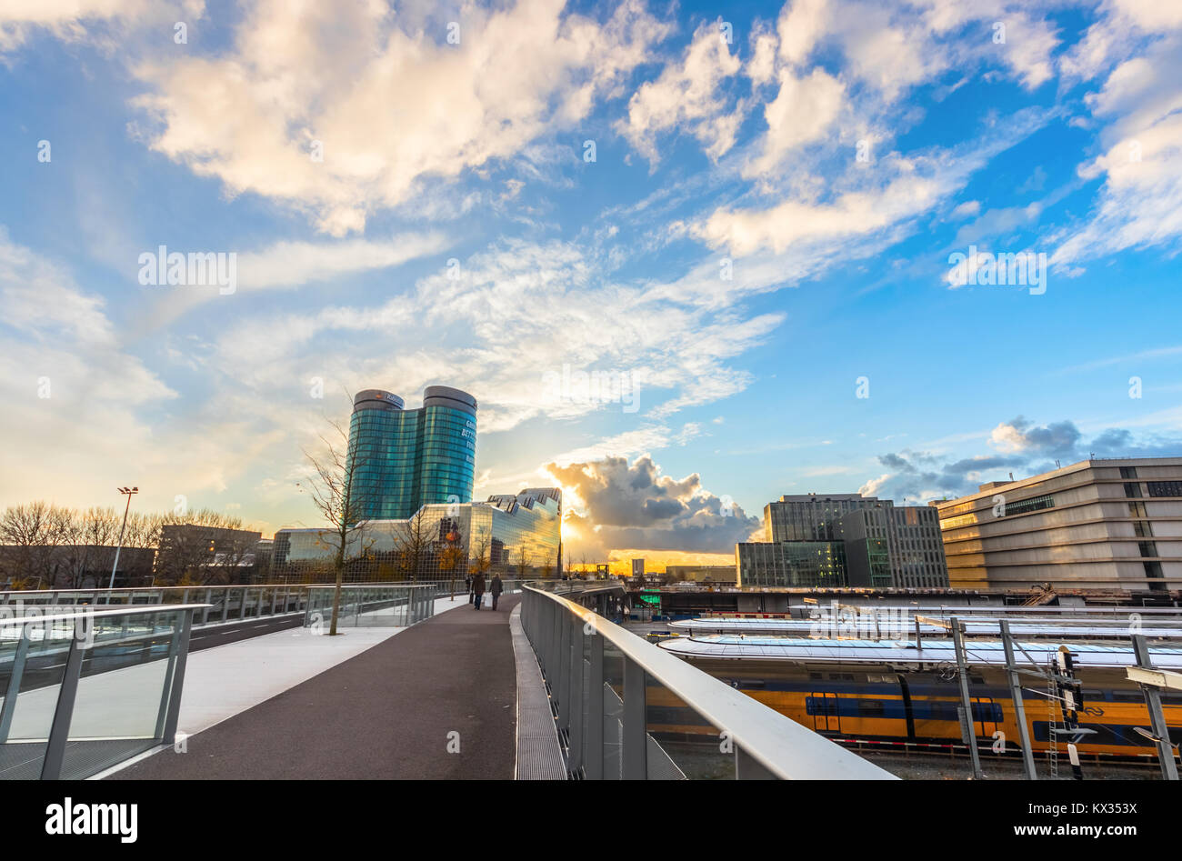 Rabobank headquarters building, the Jaarbeurs building and Utrecht Centraal Station viewed from the Moreelsebrug during sunset. The Netherlands. Stock Photo