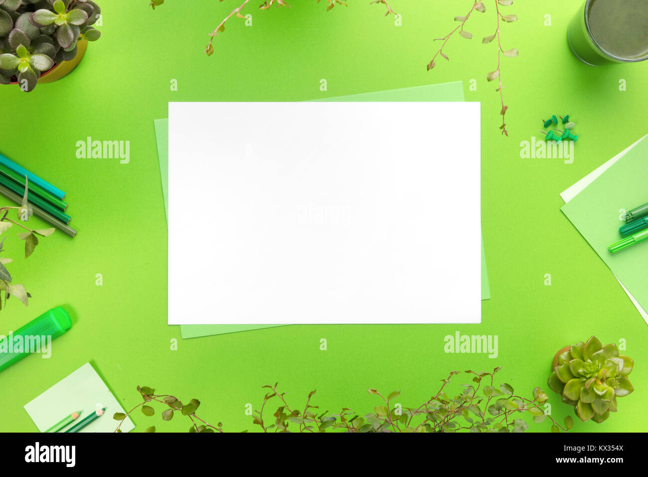 Environmental concept of a green office desk with supplies Stock Photo