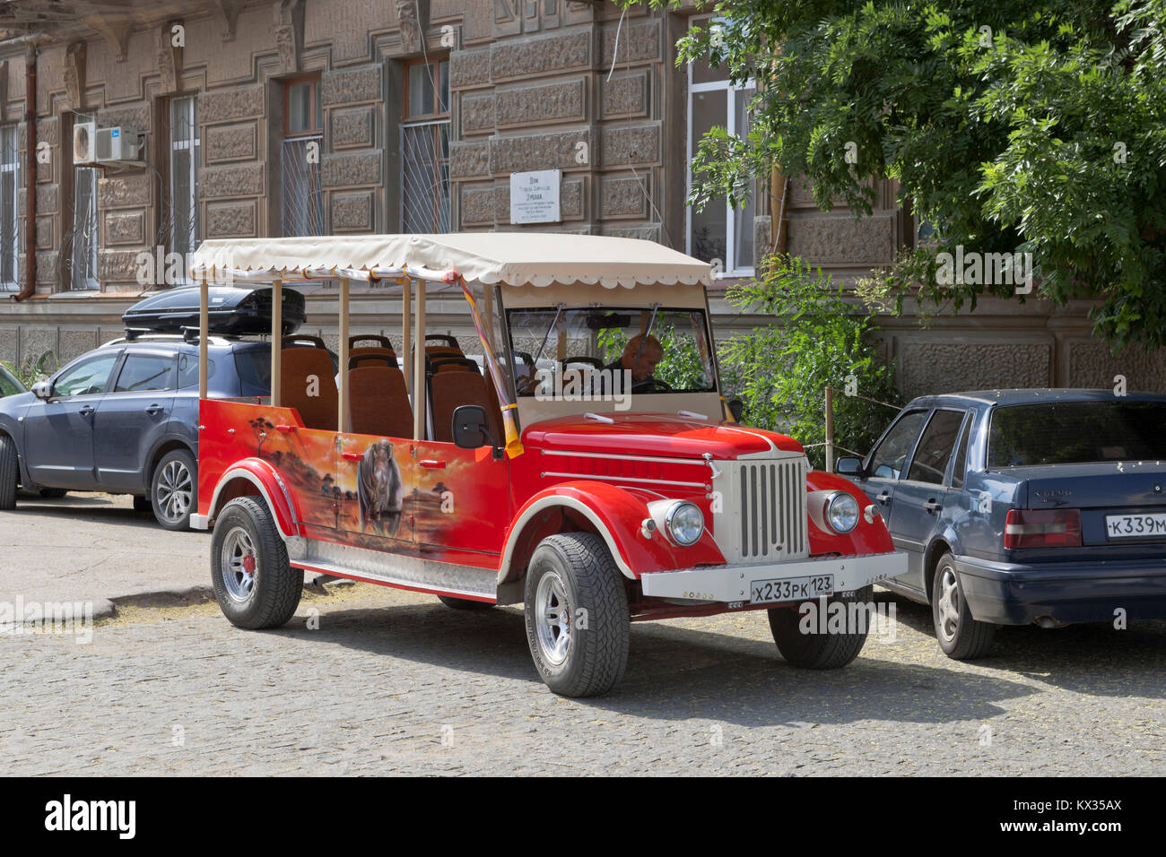 Evpatoria, Republic of Crimea, Russia - July 19, 2017: Excursion retro car on the basis of GAZ-69 near the house of Semyon Ezrovich Duvan in Evpatoria Stock Photo