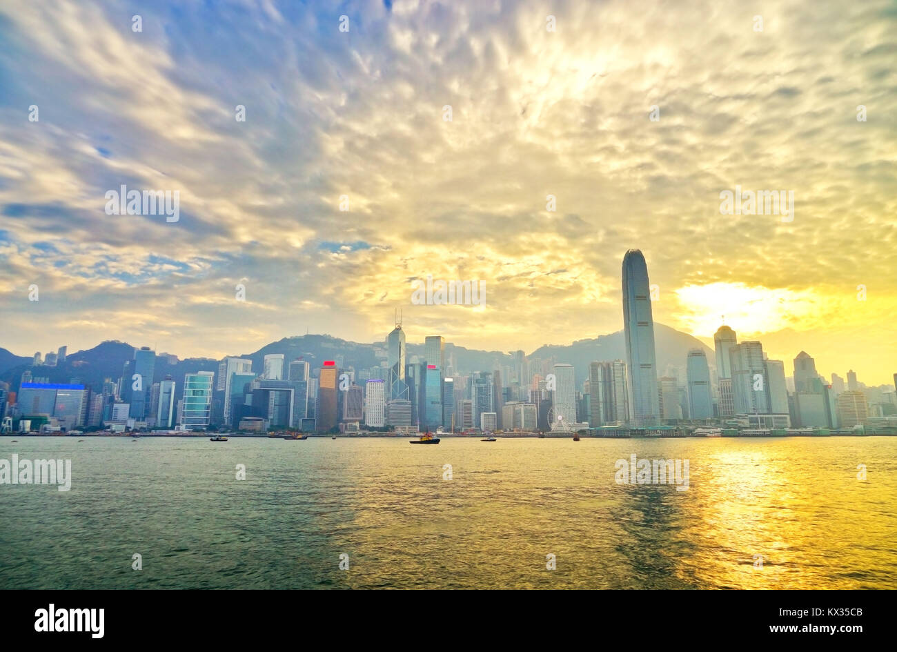 Victoria Harbor and Hong Kong skyline at sunset Stock Photo - Alamy