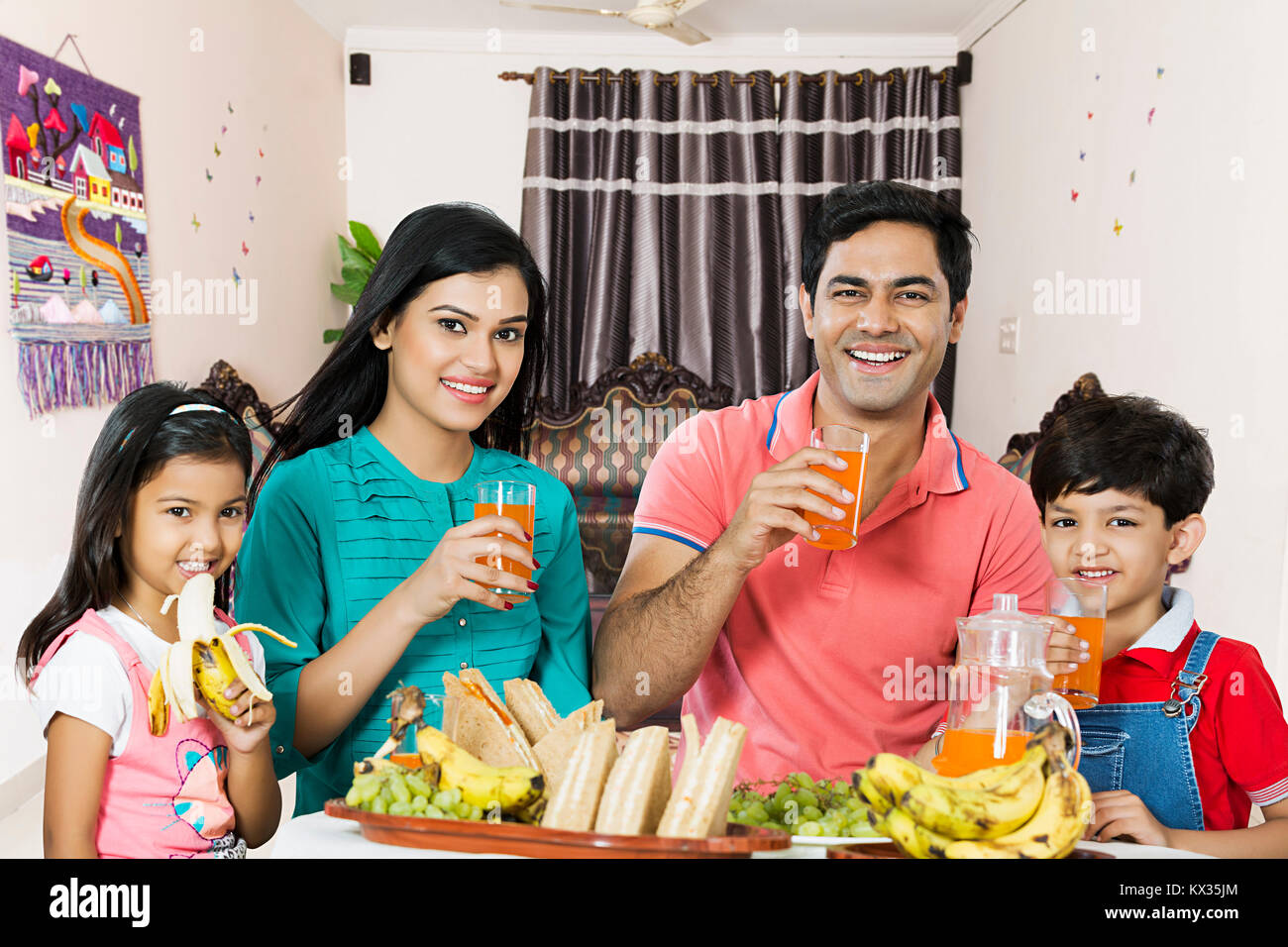Happy family With Children having their Breakfast Together Dining-Room At-Home Stock Photo