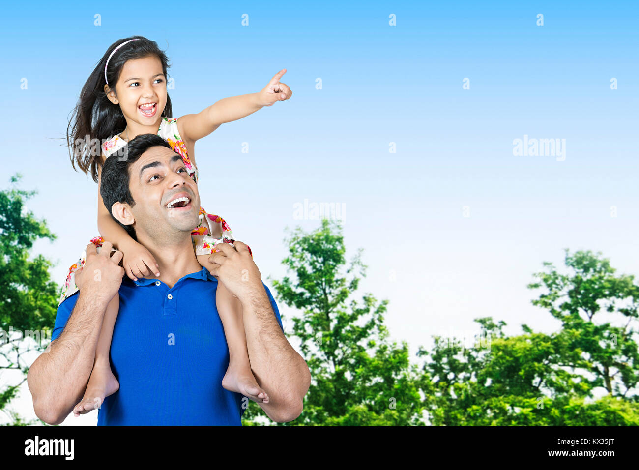 Father Carrying His Daughter On Shoulders Having Fun Pointing Park Stock Photo