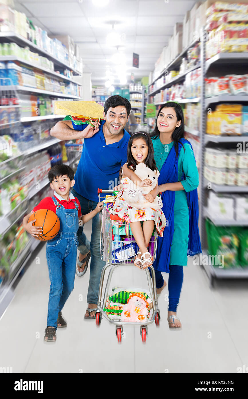 Happy Family Parents And Children Running With shopping-cart In Grocery-Store Stock Photo