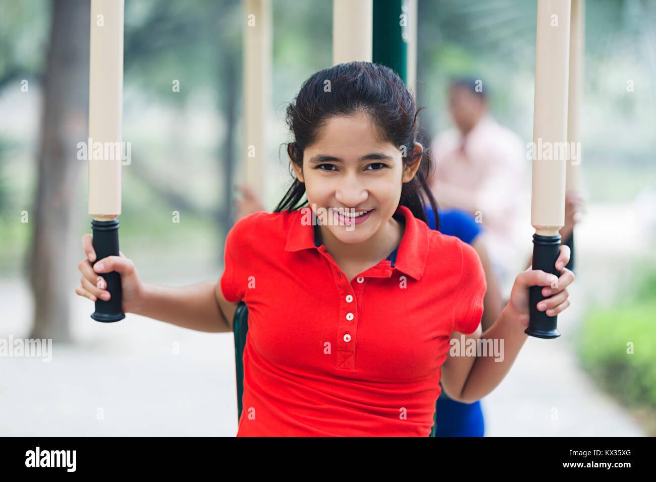 Teenager Girl Gym Exercising Machine Park Stock Photo