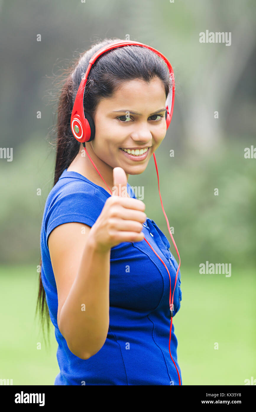 Creative young woman showing thumbs hi-res stock photography and images ...