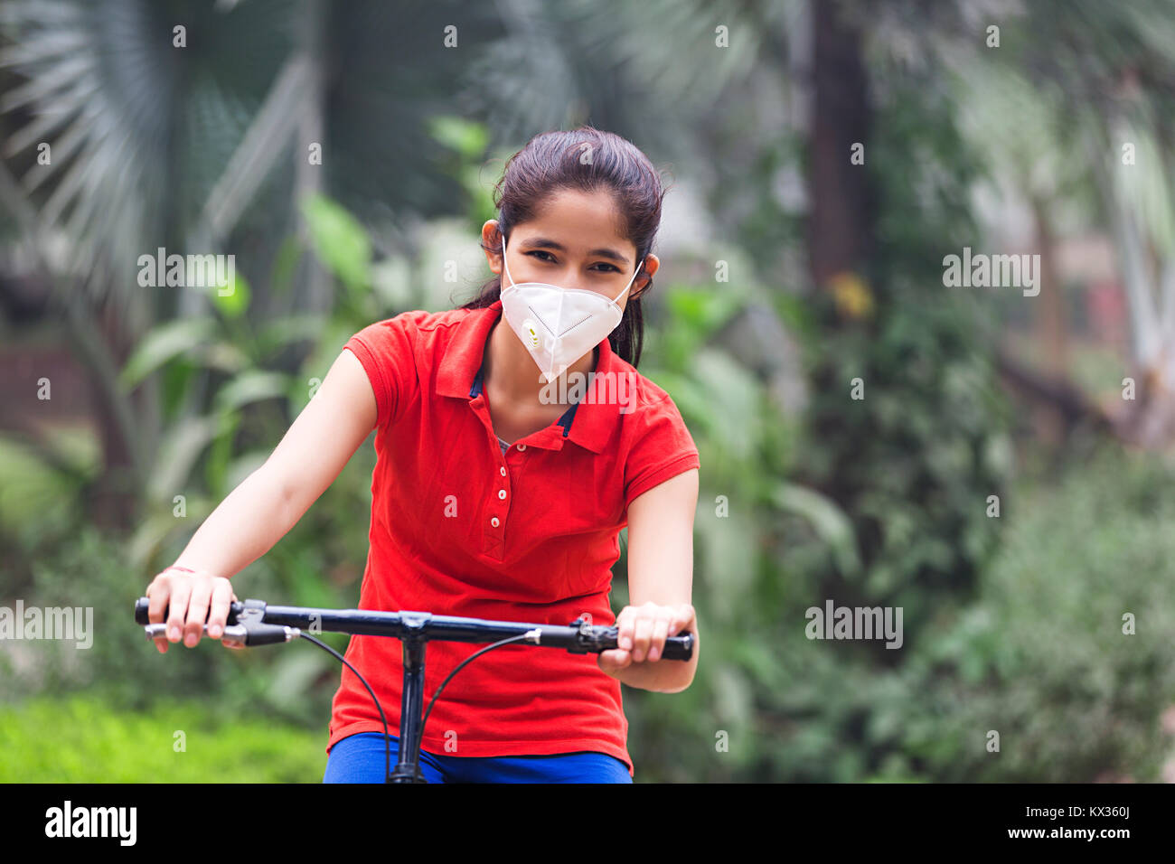 Girl riding bicycle hi-res stock photography and images - Alamy