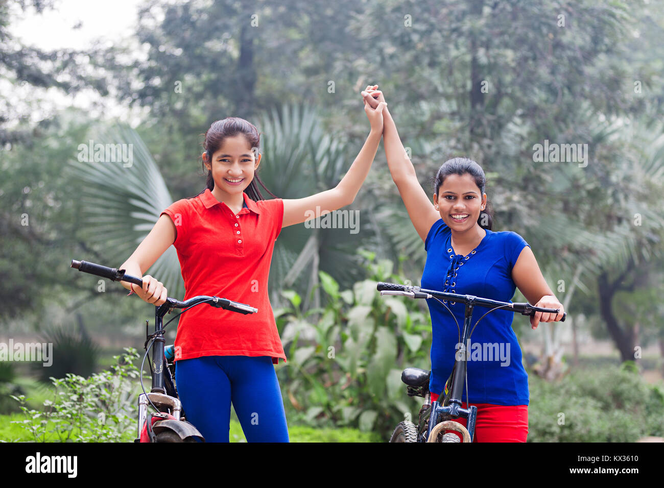 Young Girls Friend Cycling Riding Bicycle Morning Walk Stock Photo Alamy