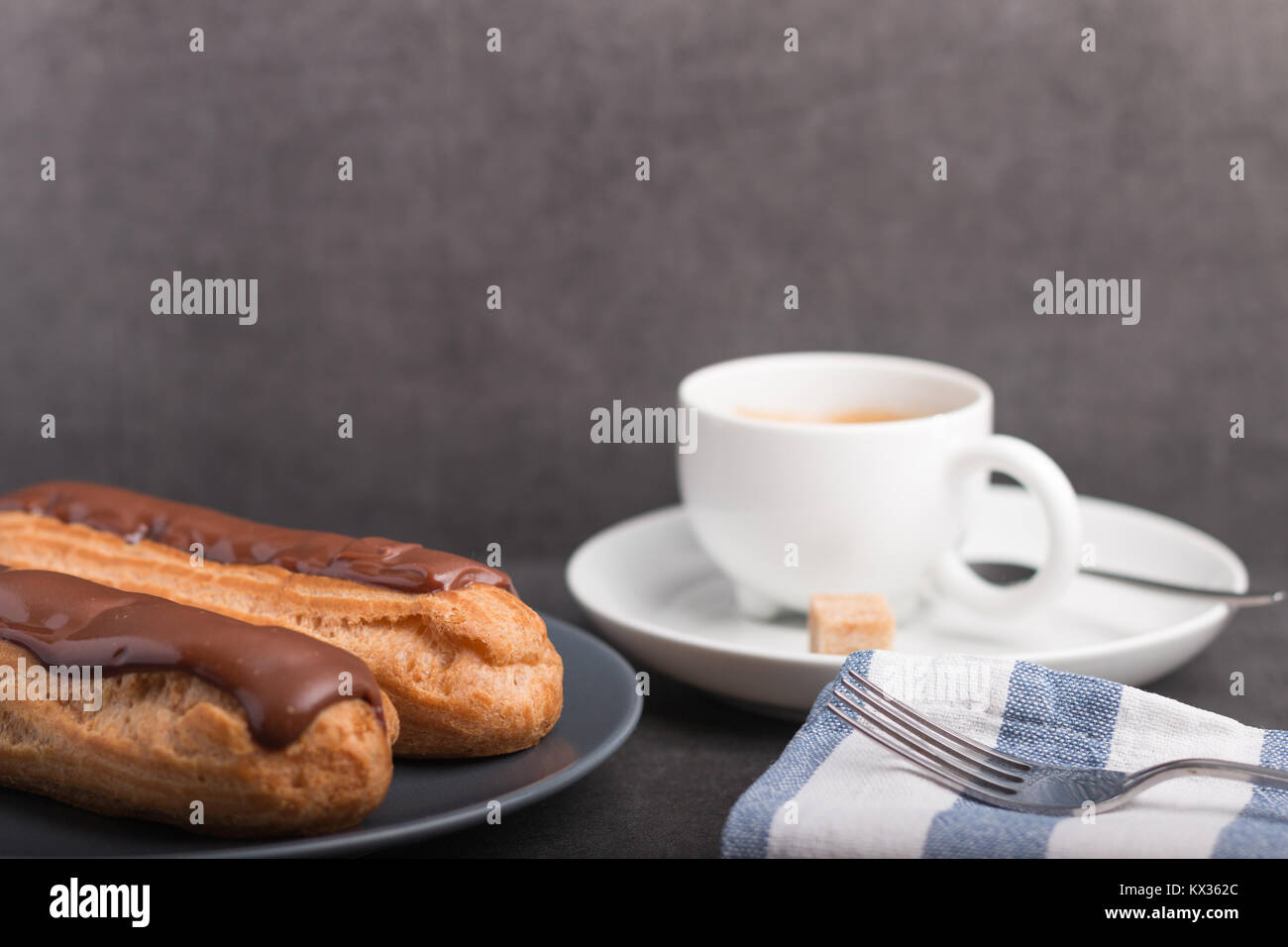 home backed eclairs with a cup of coffee Stock Photo