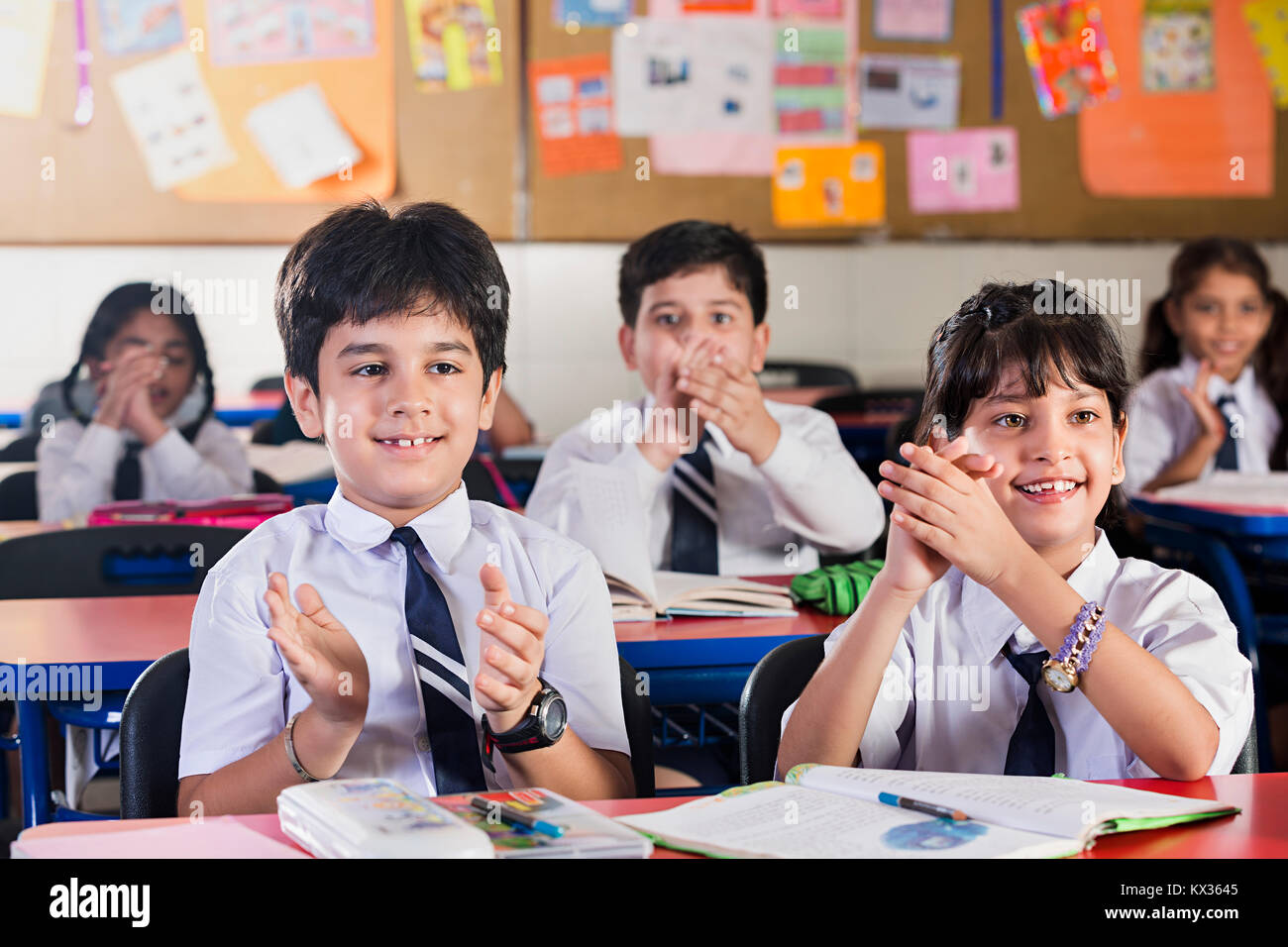 Indian School Kids Students Sitting In Classroom Hands Clapping Stock Photo