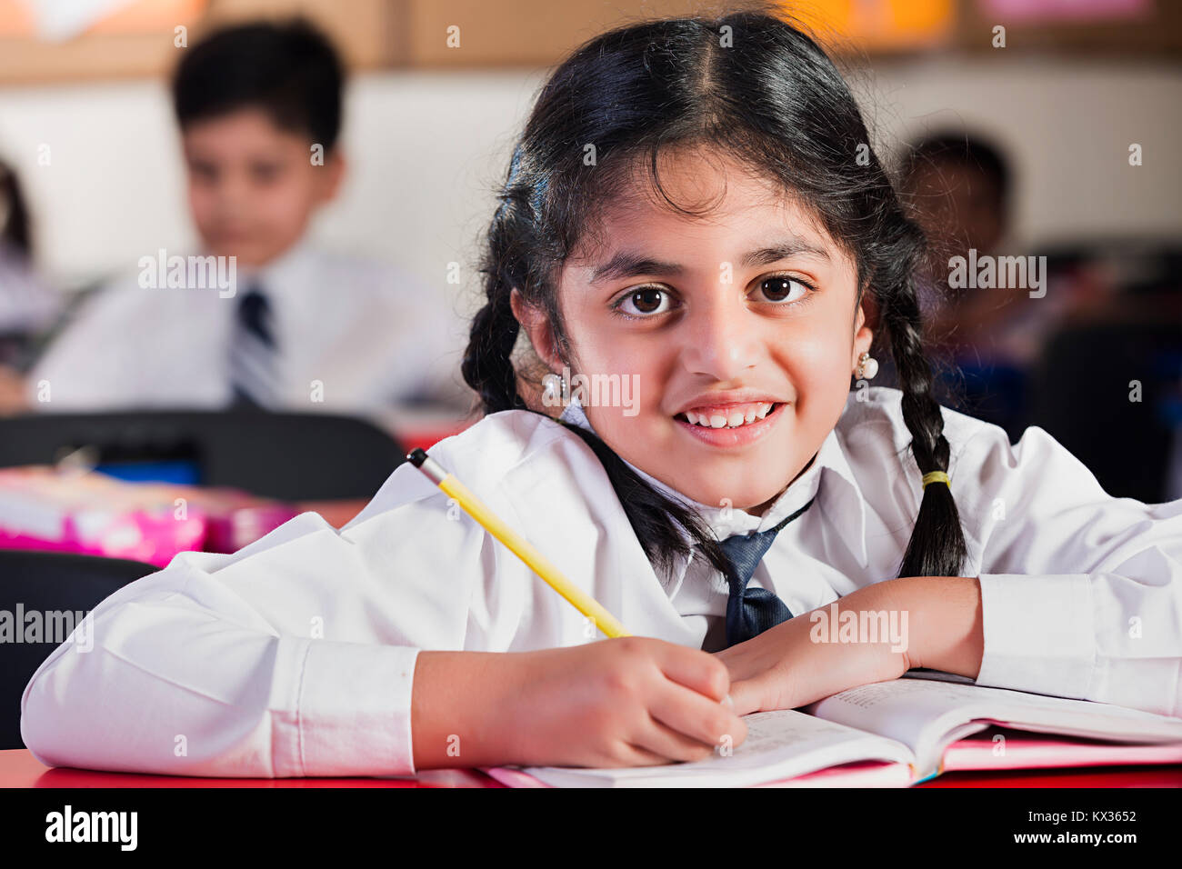 1 Indian School Little Girl Student Notebook Writing In Classroom Stock ...