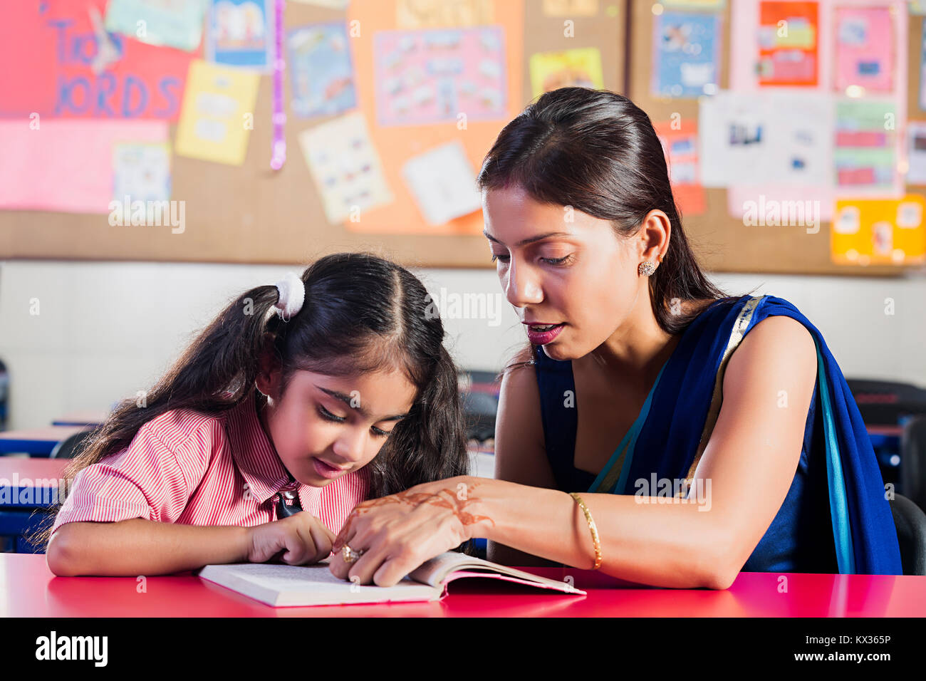 teacher and girls Indian School Kid Girl And Teacher Teaching Student In Classroom Stock  Photo - Alamy