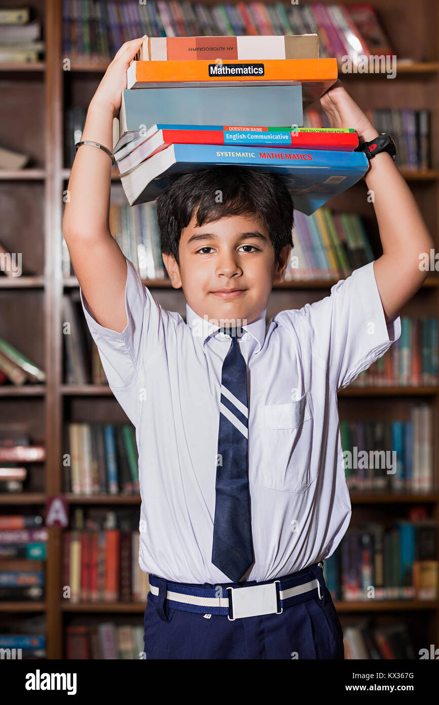 Burden 1 Indian School Little Boy Student Holding Books Study In Library Stock Photo