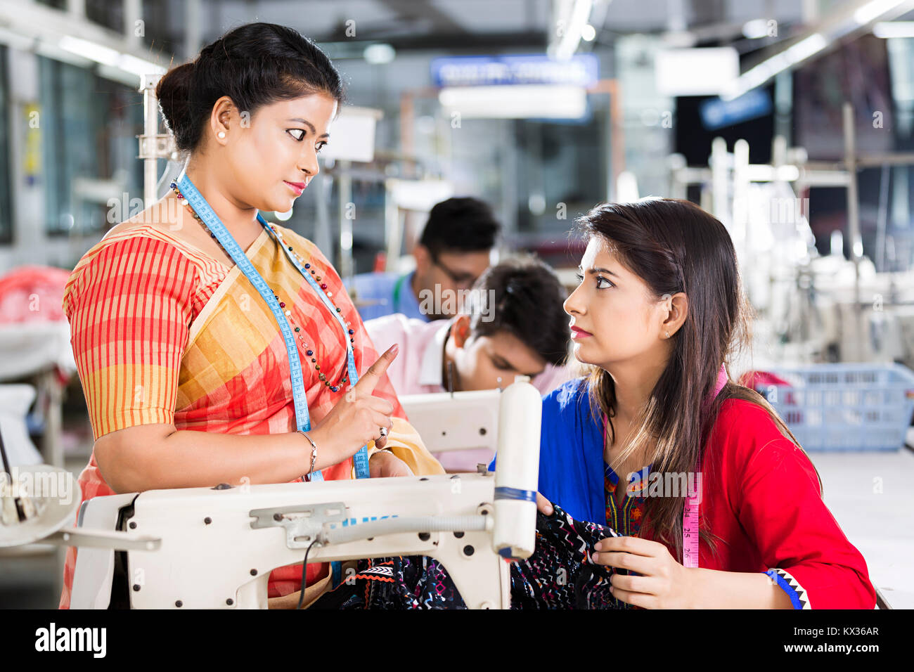 2 Women Worker Tailors Sewing Machine Helping Manager Checking Clothes