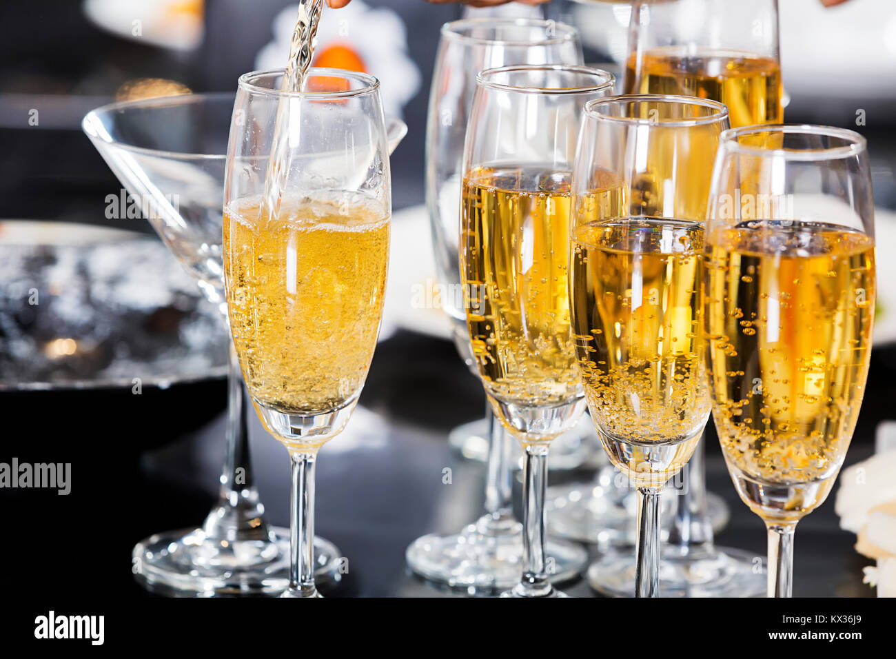 Champagne glasses on table. Celebration concept. Alcohol and cocktail party Stock Photo