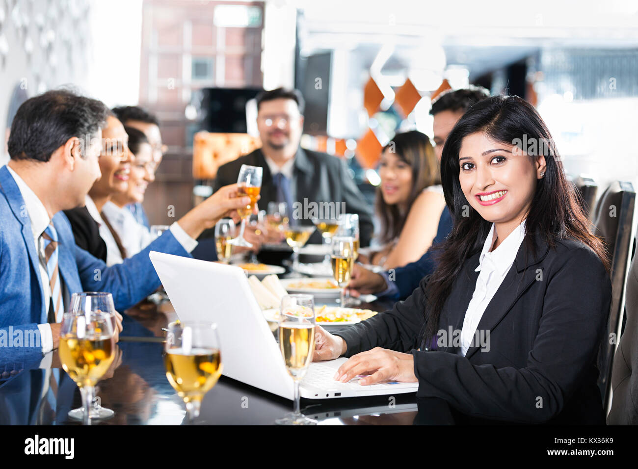 1 Business Woman Dining Table laptop Working With colleagues Restaurant -Party Stock Photo