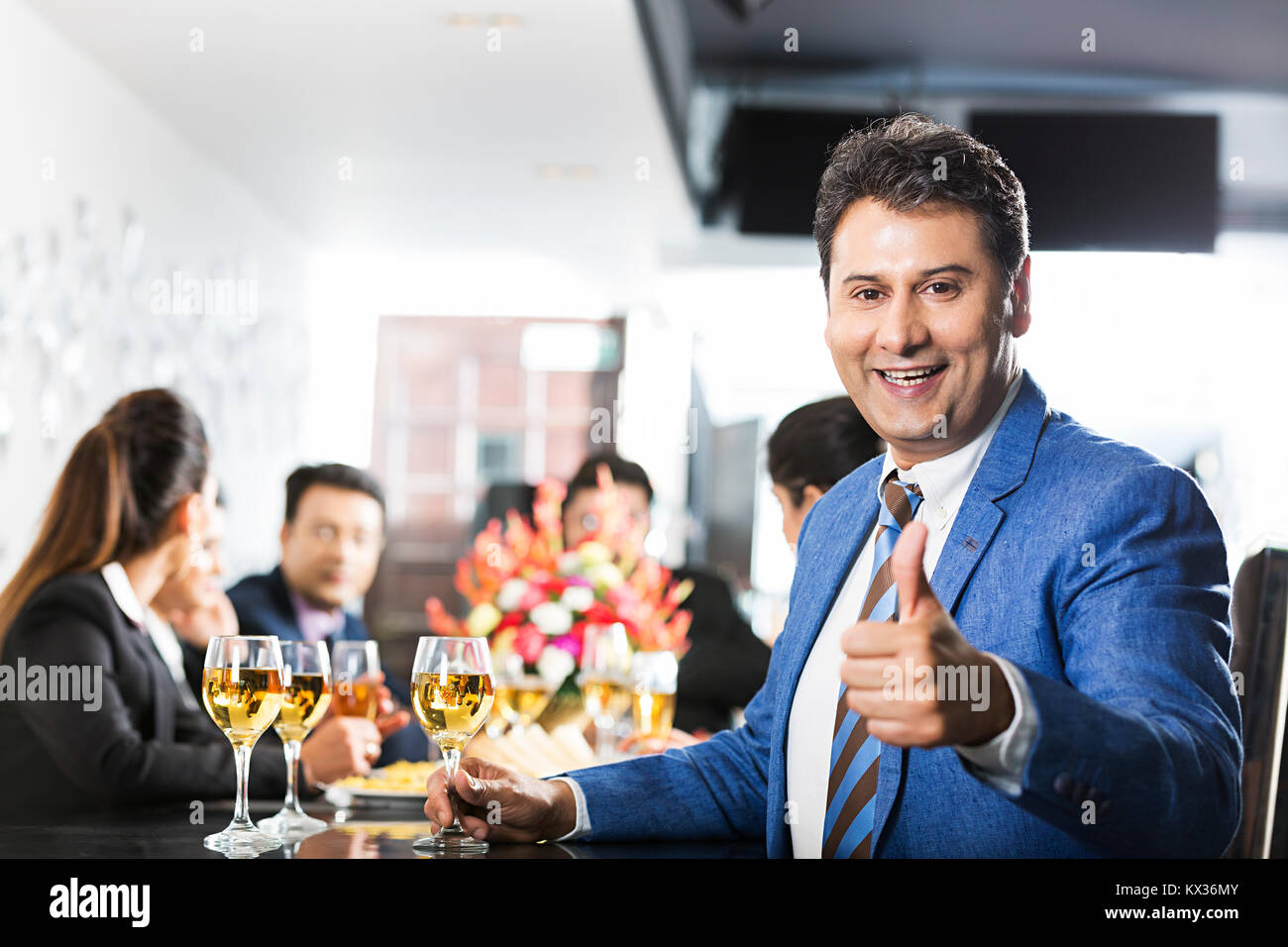 Group Business man Showing Thumbs-up with colleagues Restaurant Party Celebrating Stock Photo
