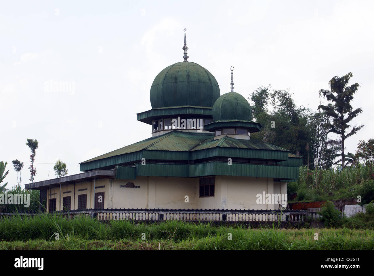 Green mosque on the field in Sumatra, Indonesia Stock Photo