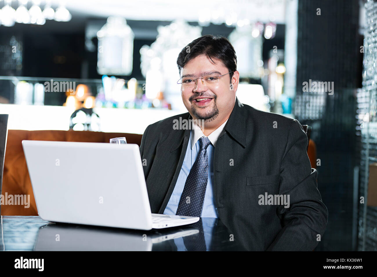 One Business Man Sitting On Table Laptop Working In Restaurant Stock Photo