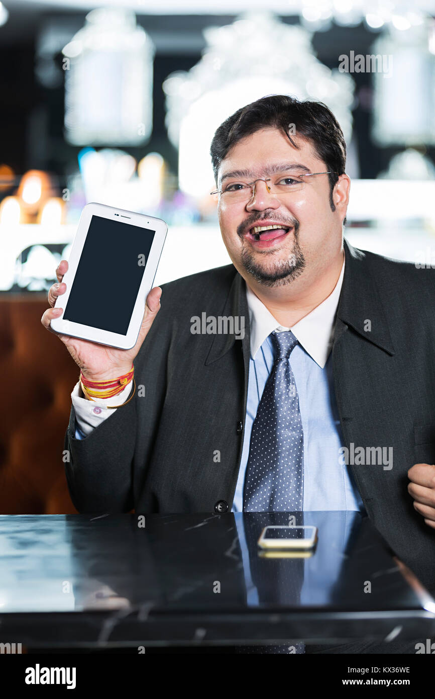 Happy One Business man Showing MobileTablet -Pc In Hotel Stock Photo