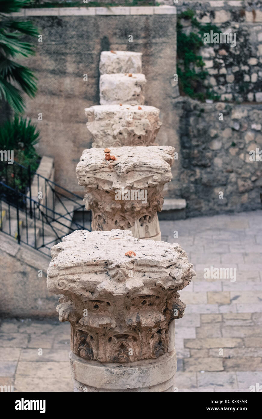 Vertical picture of the top of old pillars from Romans Age inside the
