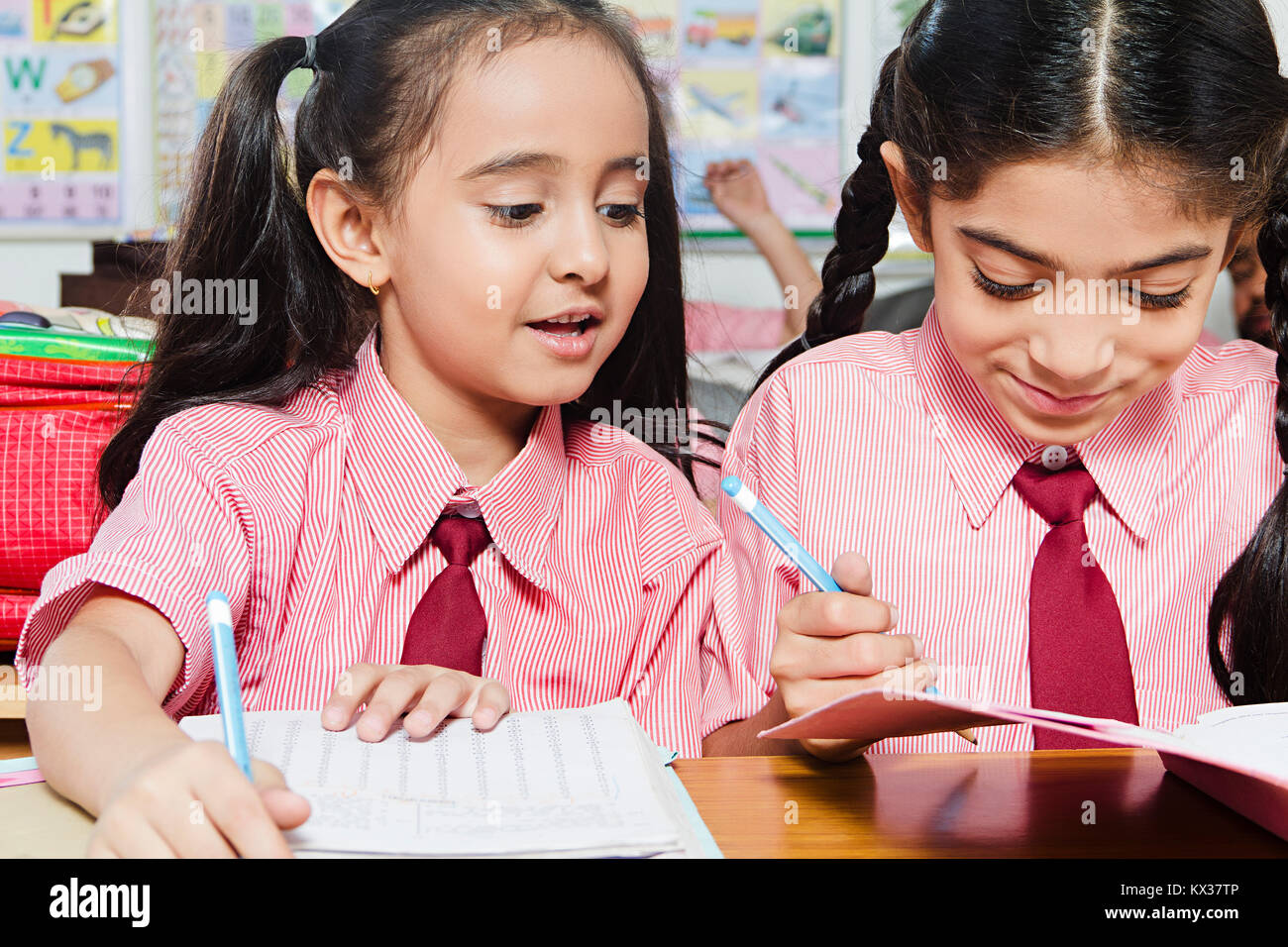 2 Indian School Kids Students Girls Writing Notebook Studying Classroom Stock Photo