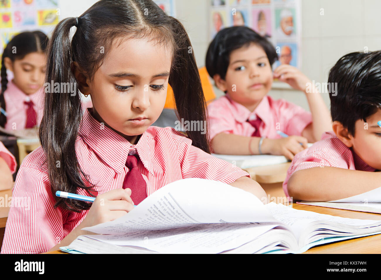 Indian School Childrens Friends Book Studying Education In Classroom Stock Photo