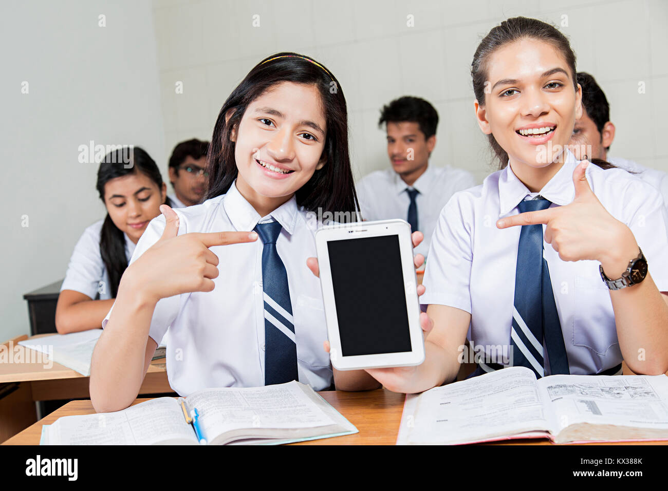 2 Indian Teenagers School Girls Student s Classmate Showing Tablet Pc Stock Photo