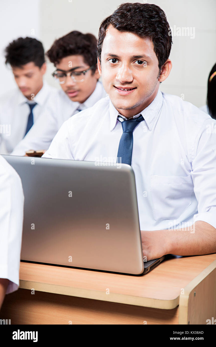 Indian School Boy Student Using Laptop Study Education In Class Stock Photo