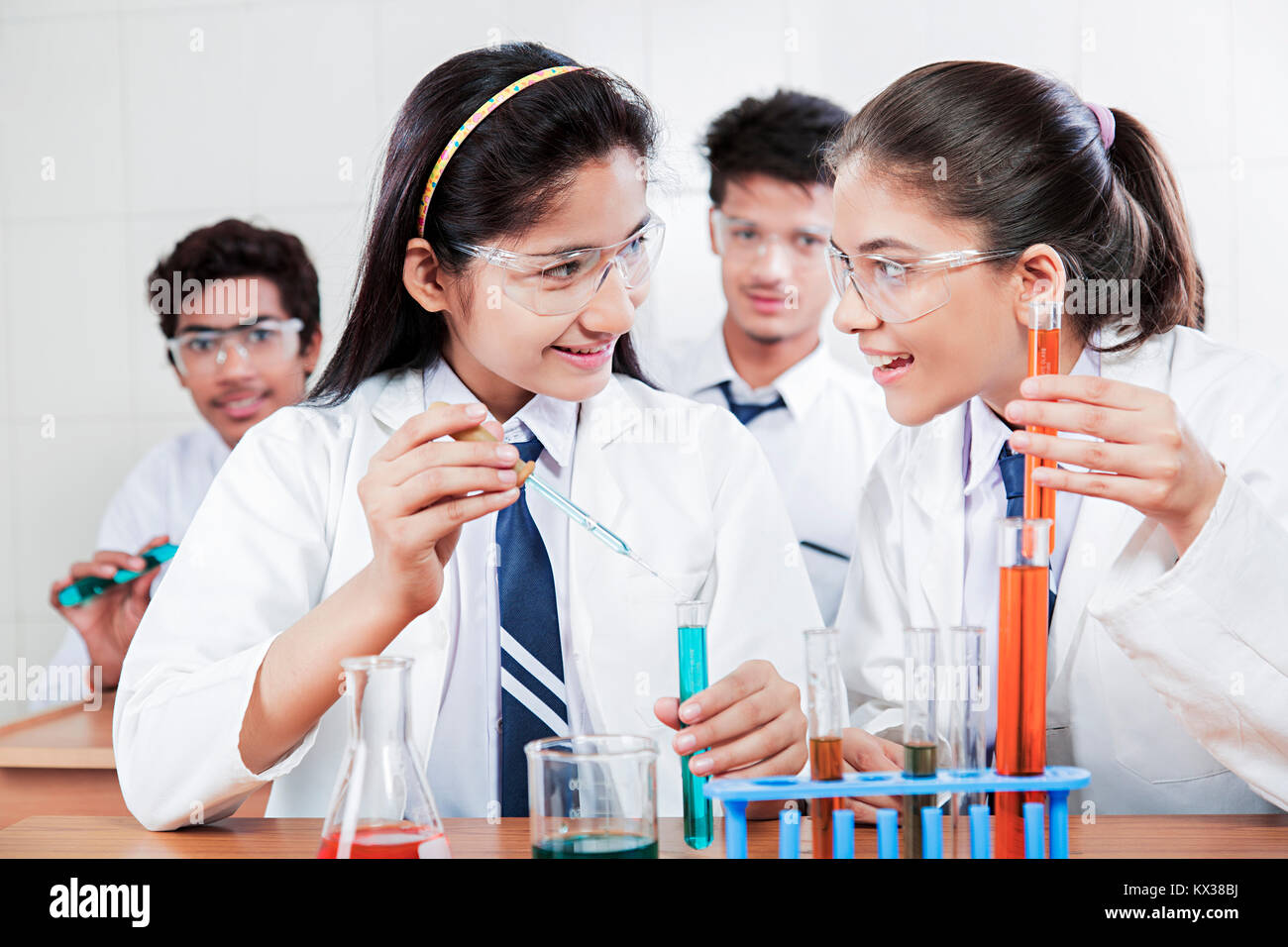 Indian School Students Doing Research using chemical liquid Science Laboratory Stock Photo