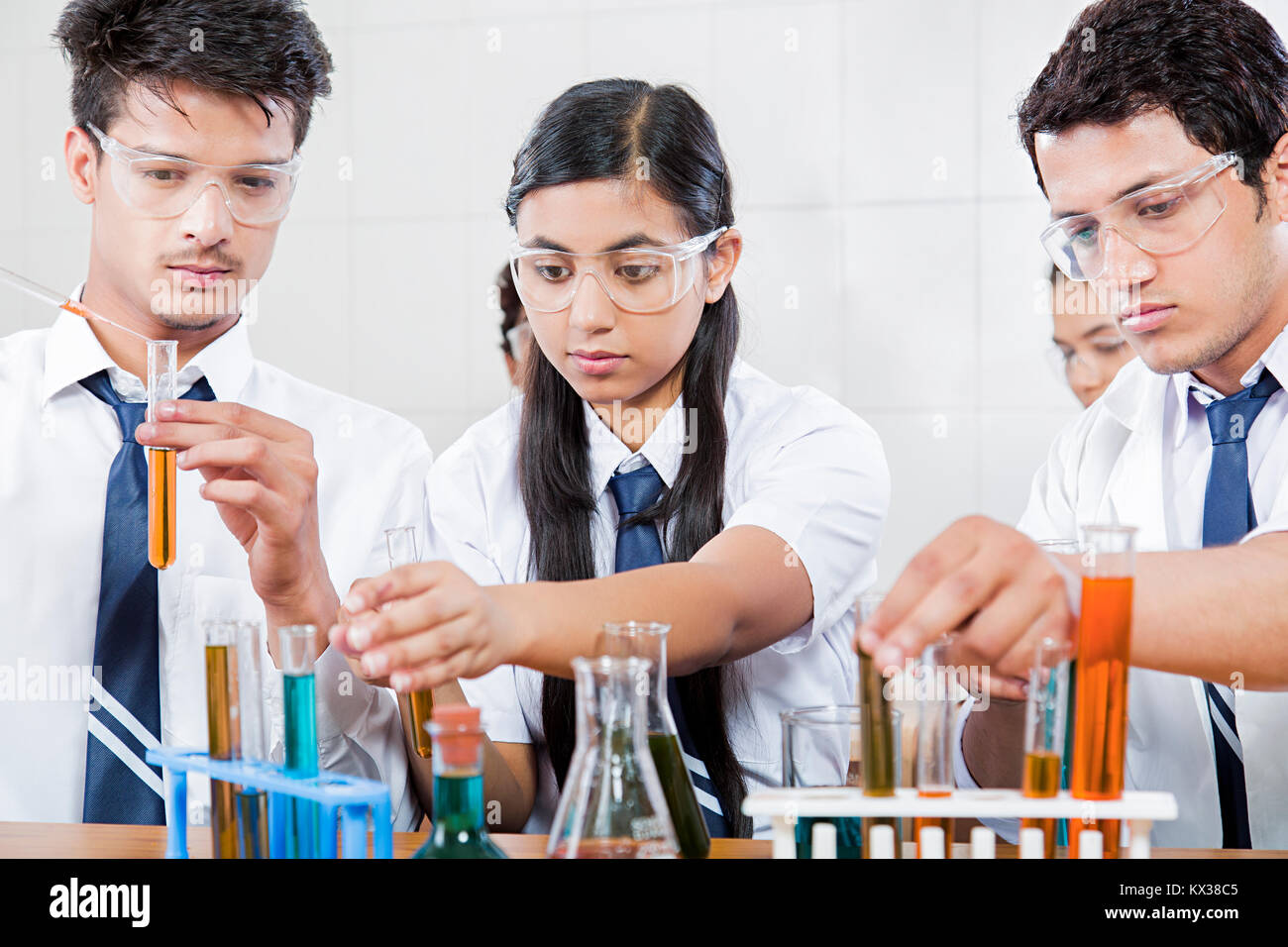 Lab partners doing chemistry experiment in high school science class Stock Photo