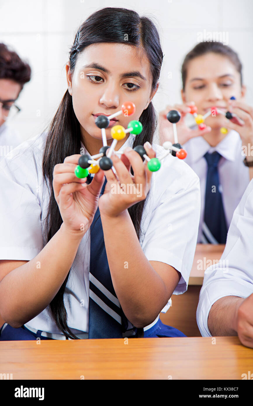 1 Indian school girl Atom Experiment Science lab Education Stock Photo