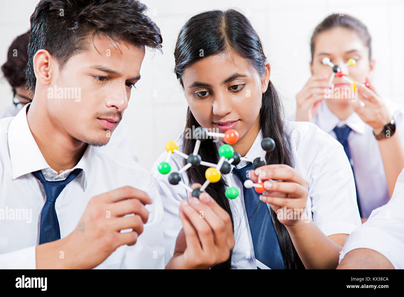 High school Science students studying plastic educational molecule model Together Stock Photo