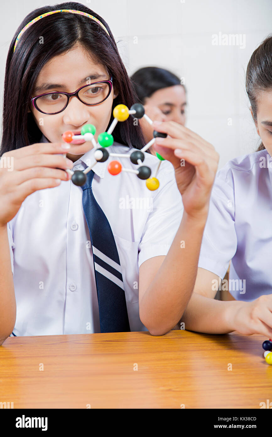 High School girls assembling molecule model science project in lab Stock Photo