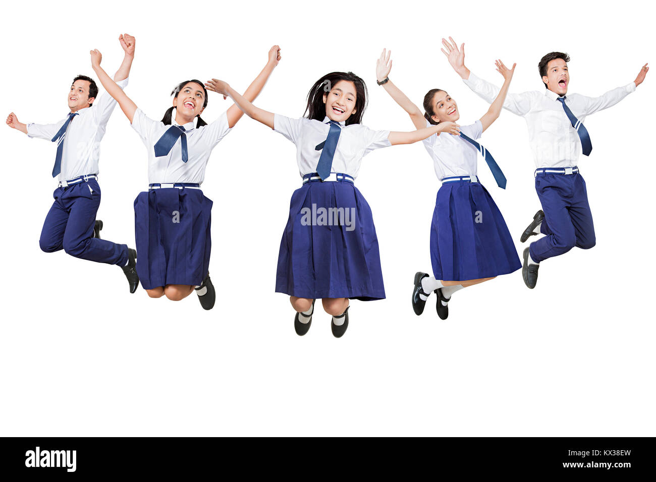 Indian Group Young School Boys And Girls Students Jumping Fun Stock Photo