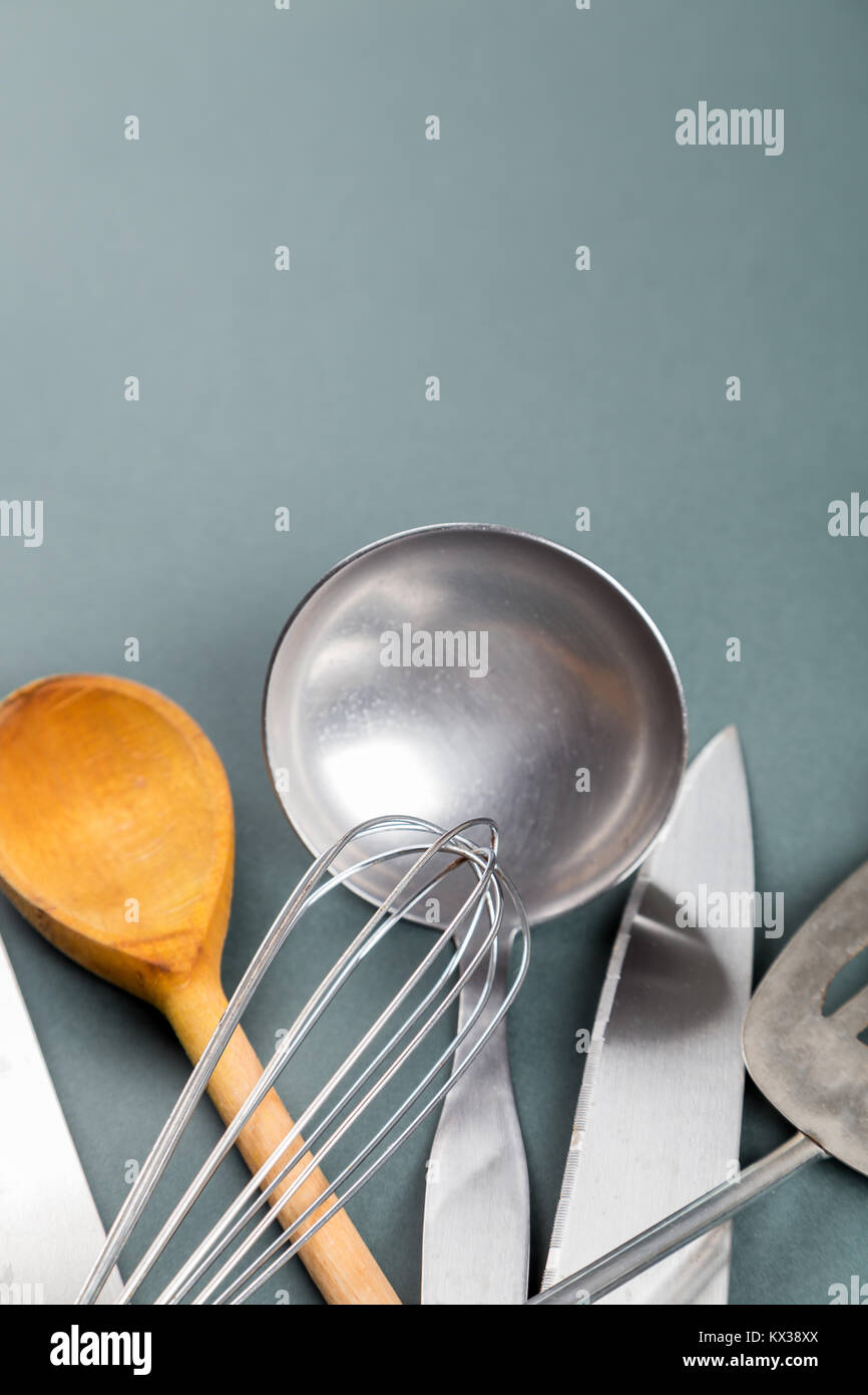 Used home kitchenware with scratches on gray paper background Stock Photo