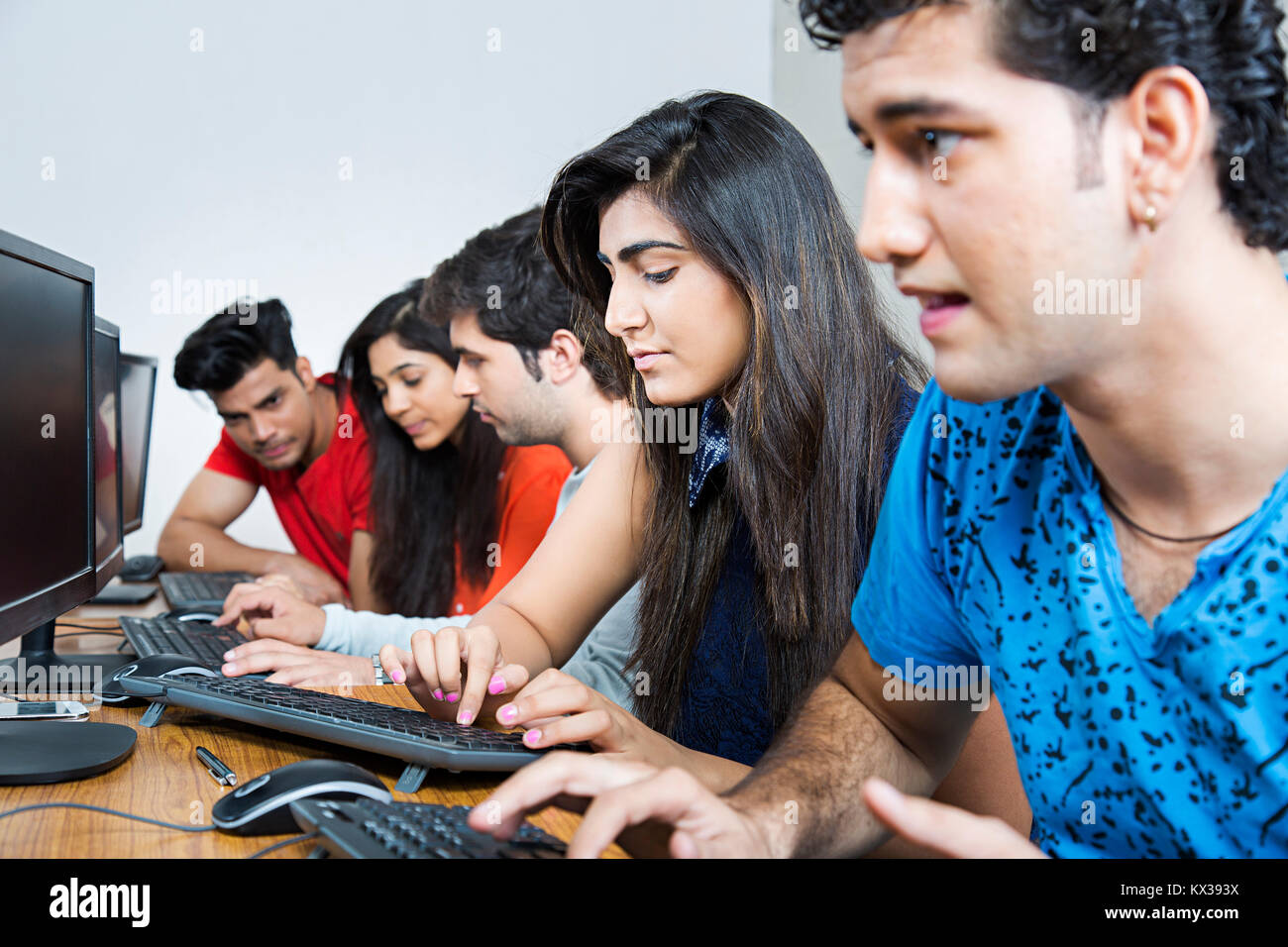 Indian College Student Boy Computer Study In Classroom Education Learning Stock Photo