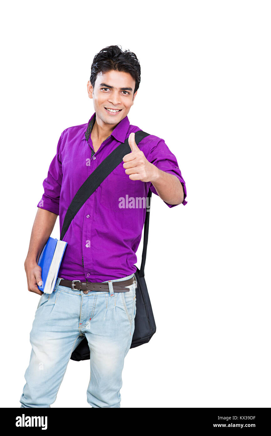 Indian young man college student holding books showing thumbsup hi-res ...