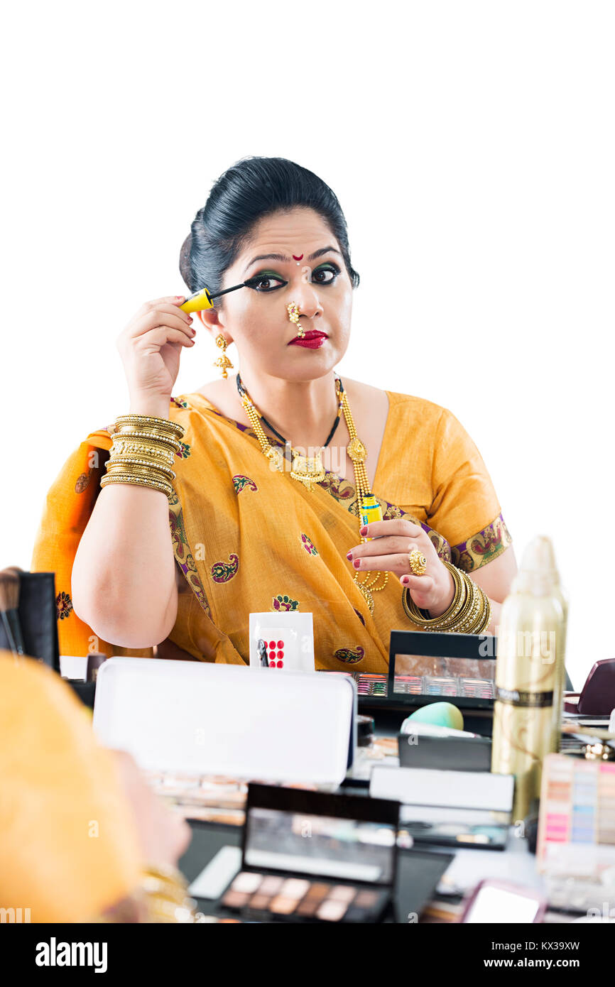 Indian Marathi Woman Getting Dressed Applying Eyelash Beauty Makeup Stock Photo