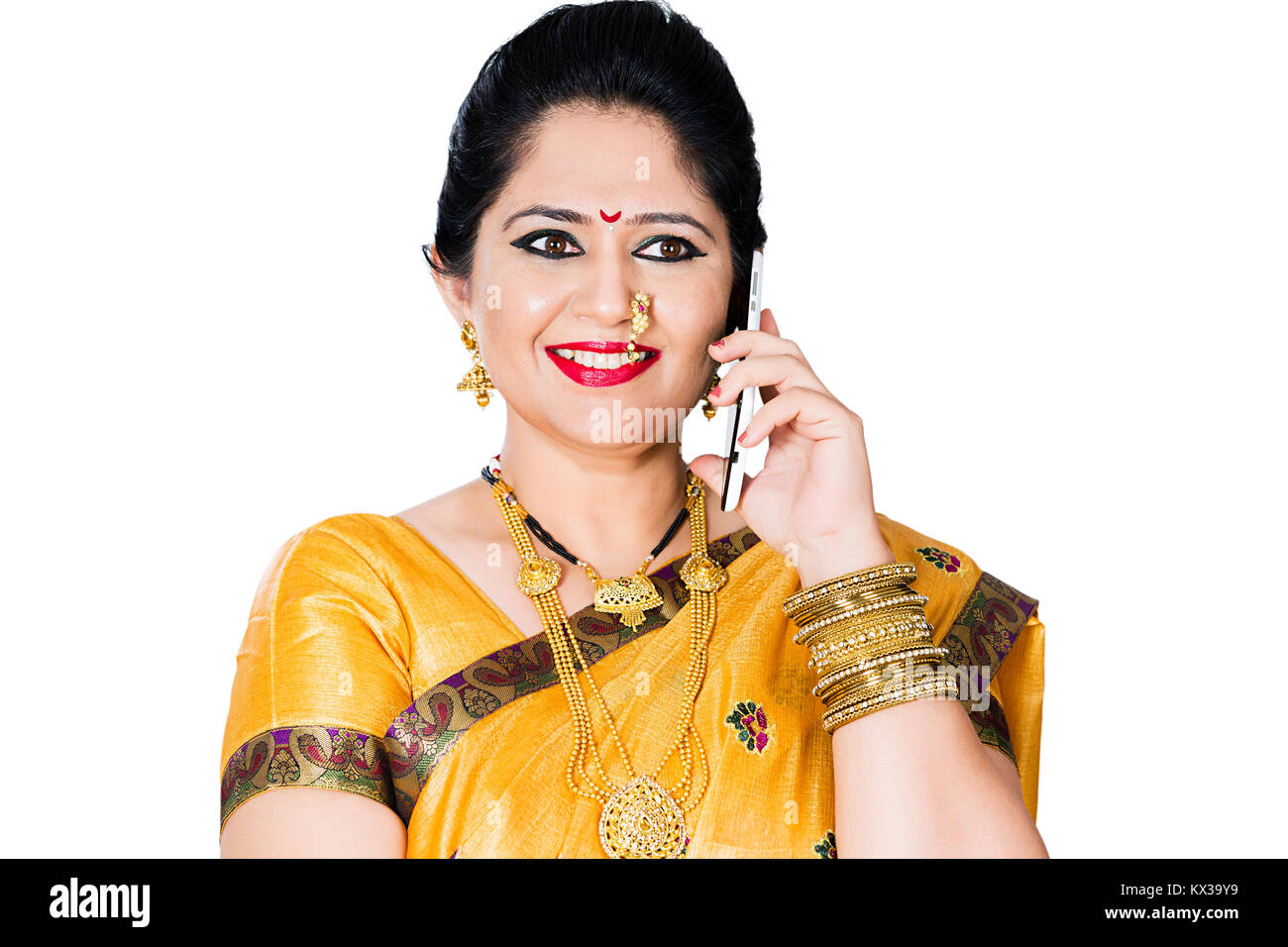Indian Traditional Marathi Woman Housewife Talking On Mobile Phone Stock Photo
