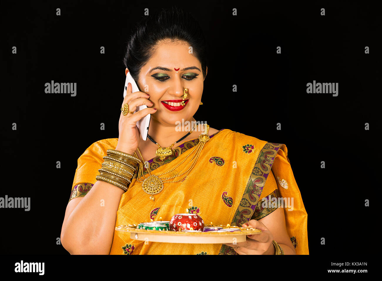 Indian Marathi Woman Diwali Festival Holding Plate Diya Talking Phone Stock Photo