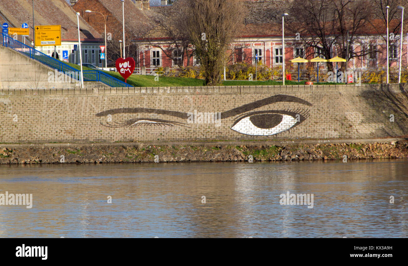 Winking from the shore. Drawn eyes on the Danube quay Stock Photo