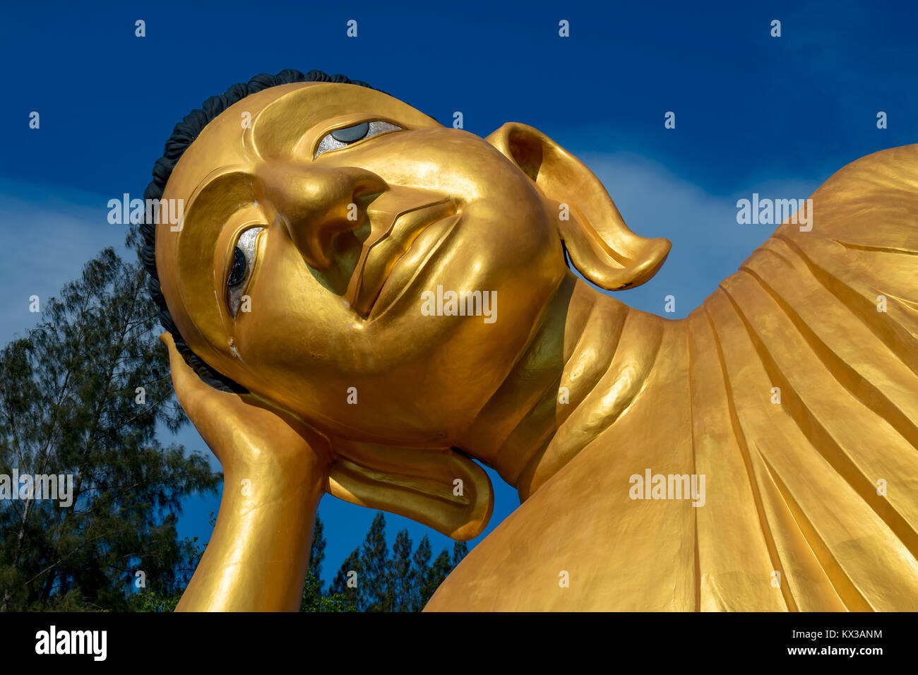 February 16, 2016 Thalang Phuket Thailand Large, golden reclining Buddha at Wat Sri Sunthon Stock Photo