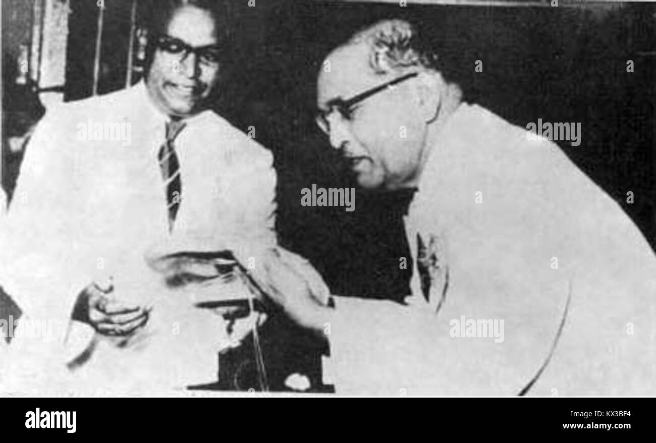 Dr. Babasaheb Ambedkar, a prominent social leader, was presented a purse as a gesture of respect by Dr. R. D. Bhandare at a public meeting in Bombay. Stock Photo