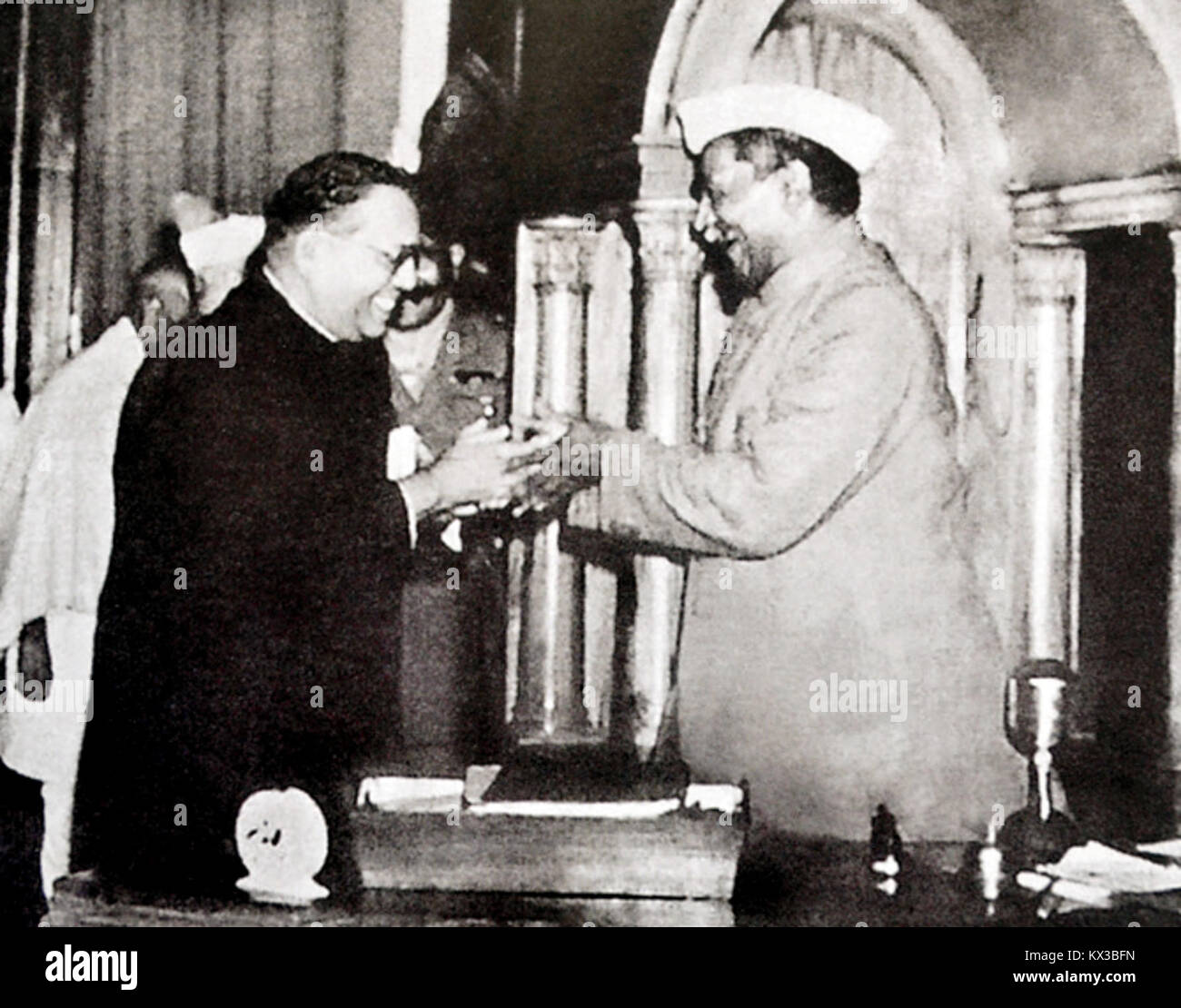 Dr. Babasaheb Ambedkar, chairman of the Drafting Committee, presenting the final draft of the Indian Constitution to Dr. Rajendra Prasad on 25 November, 1949 Stock Photo