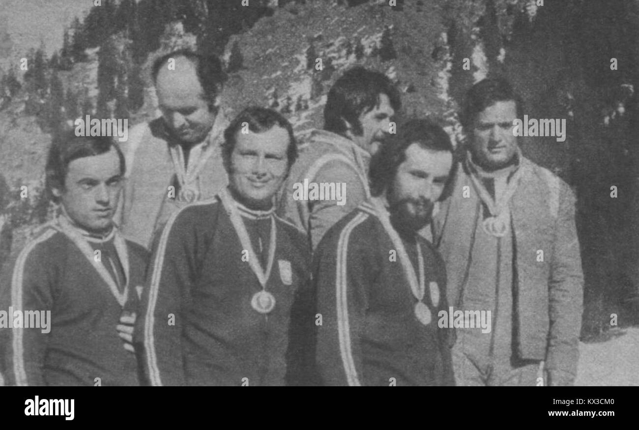 This 1974 image captures the Polish and Austrian ski jumping team at the Para-Ski event in Alta Badia. It highlights the international nature of the competition and the skill of the athletes during the Winter sports event. Stock Photo